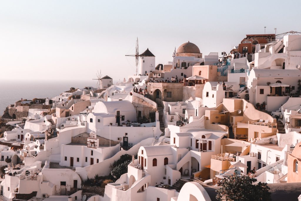 golden hour photo of Santorini hillside's white houses 