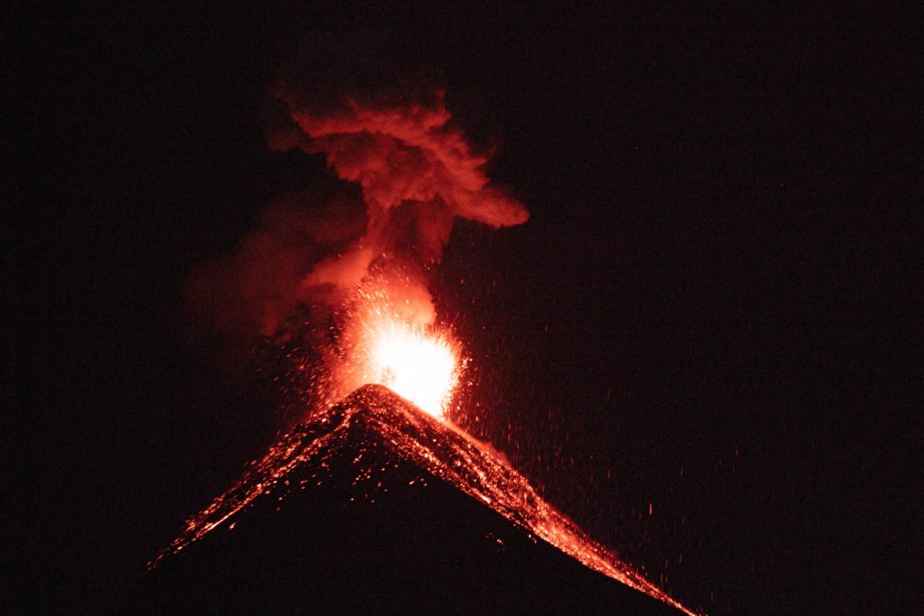 Guatemala volcano at night with red lava. One of the cheapest countries to visit